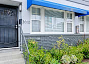 Thumbnail 1 of 24 - the front of a house with a black door
