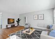Thumbnail 5 of 24 - a living room with white furniture and a tv