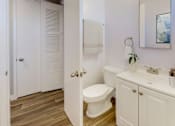 Thumbnail 15 of 23 - a bathroom with a toilet and a sink