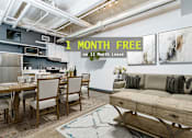Thumbnail 1 of 45 - A living room with a couch, a dining table and a rug.