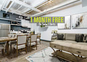Thumbnail 1 of 45 - A modern kitchen and dining area with a sign offering 1 month free on select units.