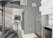 Thumbnail 21 of 45 - a kitchen with a stainless steel refrigerator next to a spiral staircase