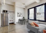 Thumbnail 23 of 45 - a kitchen and living room with a large window