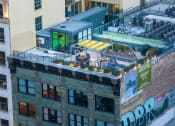 Thumbnail 34 of 45 - a rooftop bar in a city