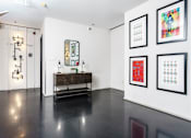 Thumbnail 12 of 37 - a room with white walls and black floors