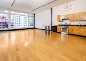 Thumbnail 36 of 37 - an empty room with a large window and a wooden floor
