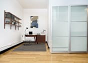 Thumbnail 5 of 37 - a home office with a desk and a glass door