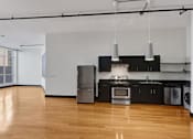 Thumbnail 28 of 37 - a kitchen with a stove top oven next to a refrigerator