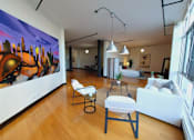 Thumbnail 29 of 37 - a living room filled with furniture and a large painting