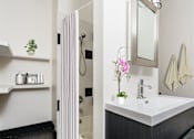 Thumbnail 7 of 37 - a small bathroom with a sink and a shower