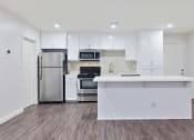Thumbnail 40 of 76 - Open Kitchen with Large Island