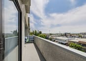 Thumbnail 30 of 46 - A balcony with a view of the cityscape.