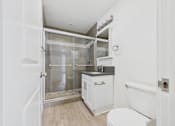 Thumbnail 121 of 135 - A white bathroom with a walk-in shower.