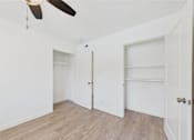 Thumbnail 118 of 135 - A room with a ceiling fan and two doors.