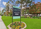 Thumbnail 11 of 64 - A sign for the leasing office of Sepulveda West apartments.
