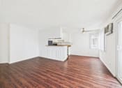 Thumbnail 20 of 88 - A kitchen area with a white cabinet and a countertop.