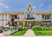 Thumbnail 18 of 19 - A house with a banner that says "LASING" in front of it.