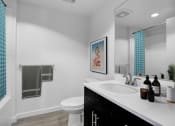 Thumbnail 9 of 22 - a white bathroom with a sink and a toilet