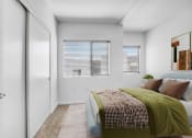 Thumbnail 6 of 22 - a bedroom with a bed and a window