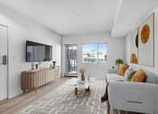 Thumbnail 12 of 22 - an open living room with a couch and a tv