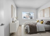 Thumbnail 16 of 22 - a bedroom with a bed and a large window