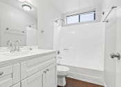 Thumbnail 10 of 15 - a bathroom with a sink toilet and a shower