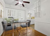 Thumbnail 7 of 35 - an open kitchen and dining room with a table and chairs