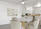 Thumbnail 3 of 49 - a kitchen with white cabinets and a white table and chairs