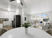 Thumbnail 2 of 49 - a living room and dining room with a white table