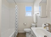 Thumbnail 9 of 49 - a bathroom with a sink toilet and a shower