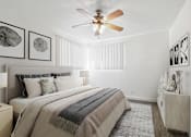 Thumbnail 7 of 49 - a bedroom with a large bed and a ceiling fan