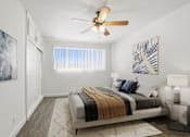 Thumbnail 8 of 49 - a bedroom with a bed and a ceiling fan