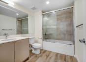 Thumbnail 63 of 75 - a bathroom with a sink toilet and shower