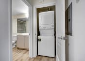 Thumbnail 14 of 75 - a room with a washer and dryer in it