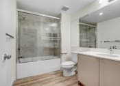 Thumbnail 15 of 75 - a bathroom with a toilet sink and shower