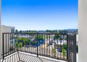 Thumbnail 43 of 75 - a balcony with a view of a parking lot