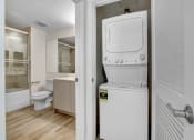 Thumbnail 46 of 75 - a room with a washer and dryer in it