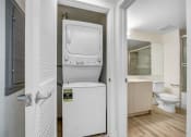 Thumbnail 25 of 75 - a washer and dryer in a bathroom