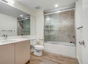 Thumbnail 27 of 75 - a bathroom with a toilet sink and bathtub
