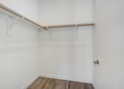 Thumbnail 75 of 75 - an empty room with white walls and a wooden floor