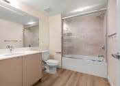 Thumbnail 70 of 75 - a bathroom with a toilet sink and bathtub