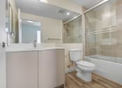 Thumbnail 67 of 75 - a bathroom with a toilet sink and bathtub