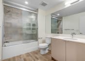 Thumbnail 20 of 75 - a bathroom with a toilet sink and bathtub