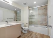 Thumbnail 40 of 75 - a bathroom with a toilet sink and bathtub