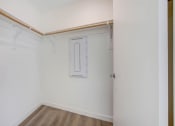 Thumbnail 54 of 75 - a room with white walls and a wooden floor
