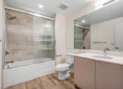 Thumbnail 34 of 75 - a bathroom with a toilet sink and bathtub