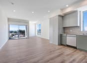 Thumbnail 32 of 75 - a kitchen and living room in a 555 waverly unit