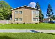 Thumbnail 2 of 7 - 12082 Cole side view building, lush landscaping, street parking on the left side
