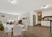 Thumbnail 39 of 76 - Dining Area With wood-style floors throughout and a kitchen to the right