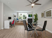 Thumbnail 36 of 76 - Dining area with a ceiling fan, wood style floors